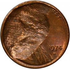 Error $0.01 1974-D Cent Struck Thru Fabric - Raw AU / BU